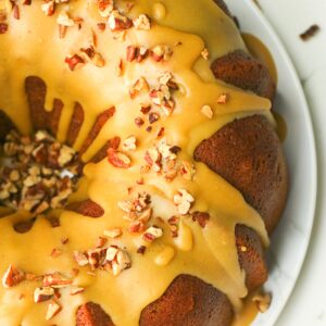 The beautifully finished pound cake with caramel glaze and toasted pecans