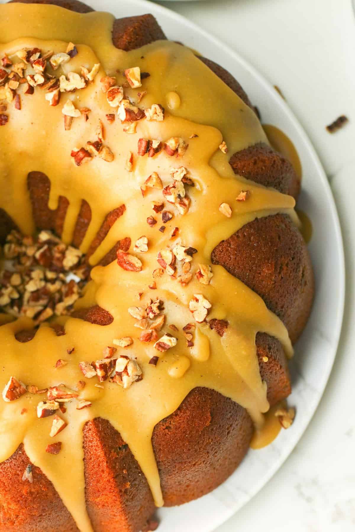 The beautifully finished pound cake with caramel glaze and toasted pecans