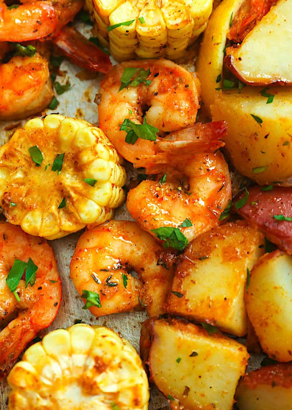 Boiled potatoes and corn grilled with smoked sausage and shrimp