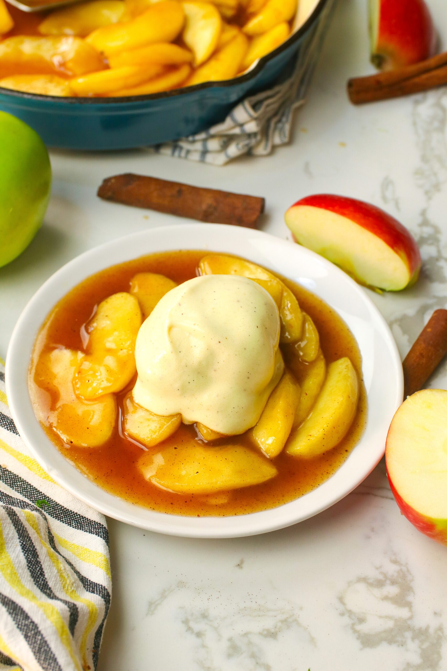 Serving warm fried apples with a scoop of vanilla ice cream for a comfort food dessert