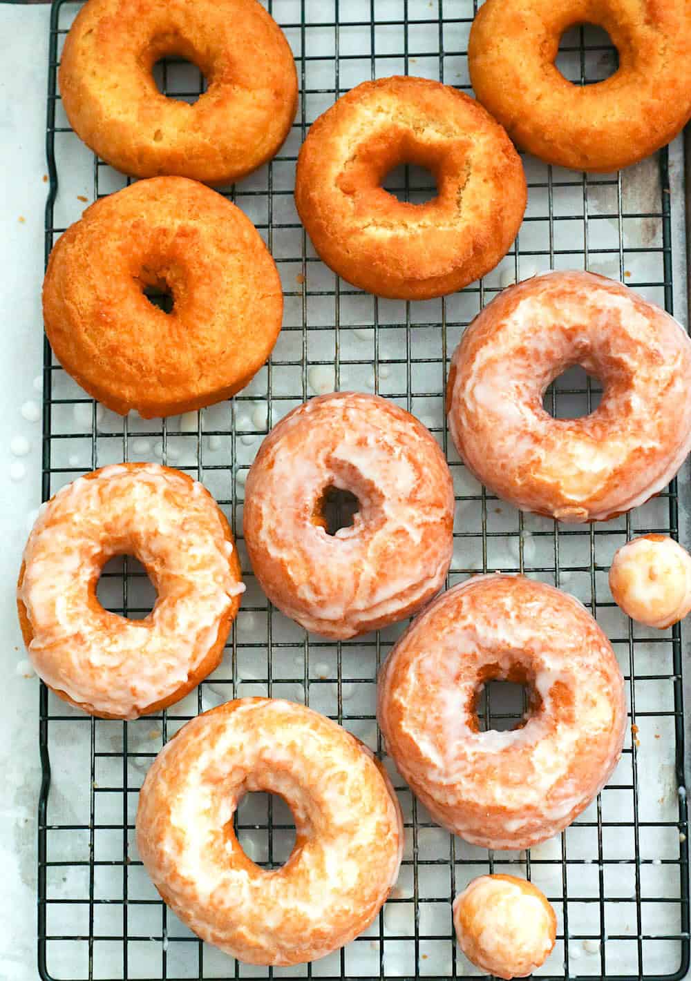 Freshly glazed and plain old fashioned doughnuts