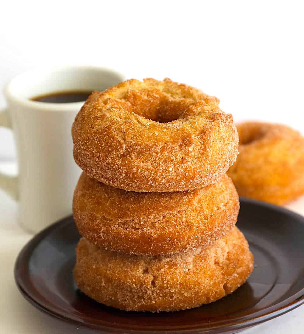 Freshly made old fashioned cake doughnuts rolled in cinnamon sugar