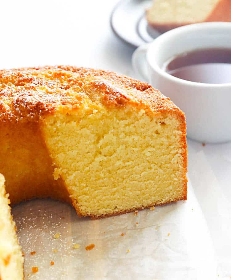 Slicing into a decadent Southern pound cake to enjoy with a cup of hot coffee