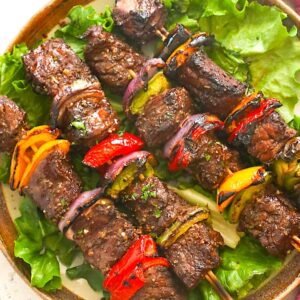 Soul-satisfying steak kabobs on a bed of lettuce