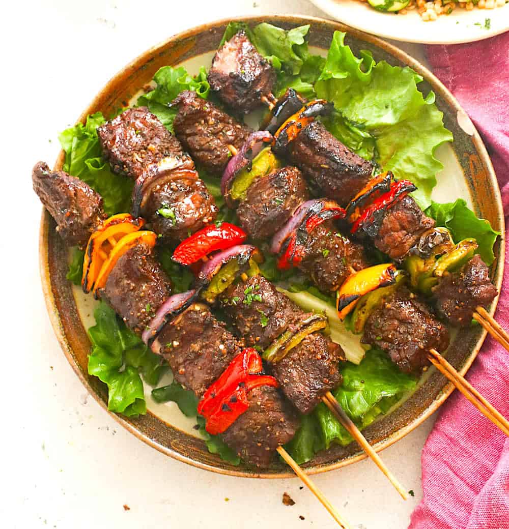 Soul-satisfying steak kabobs on a bed of lettuce