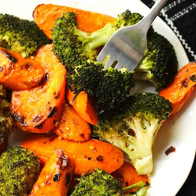 Forking into a deliciously healthy plate of roasted broccoli and carrots