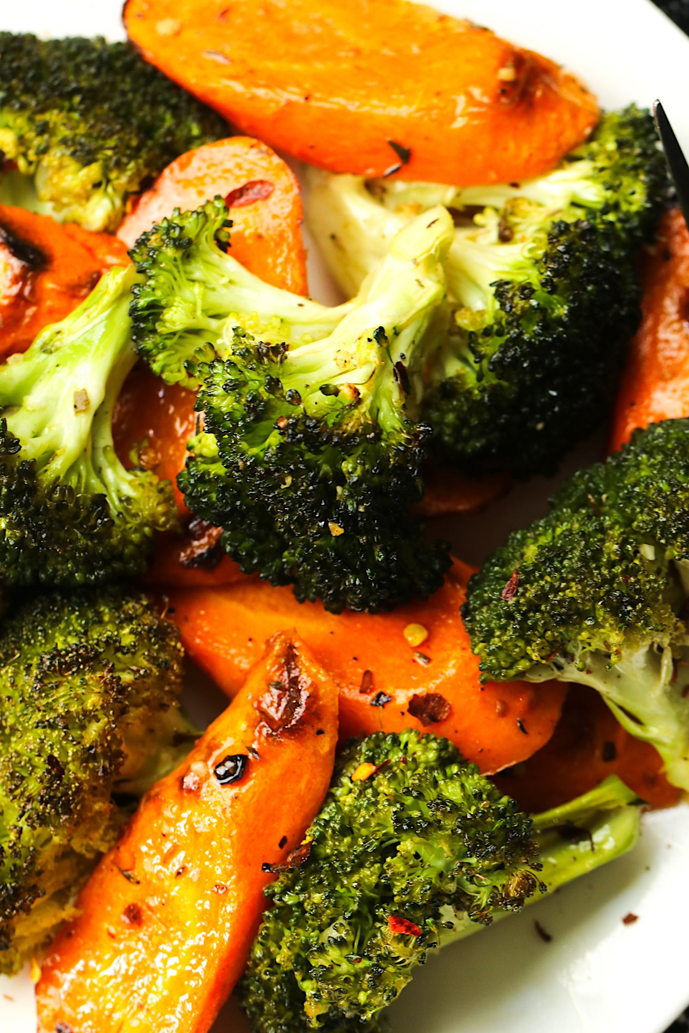 Serving up freshly roasted broccoli and carrots for a quick and easy side dish