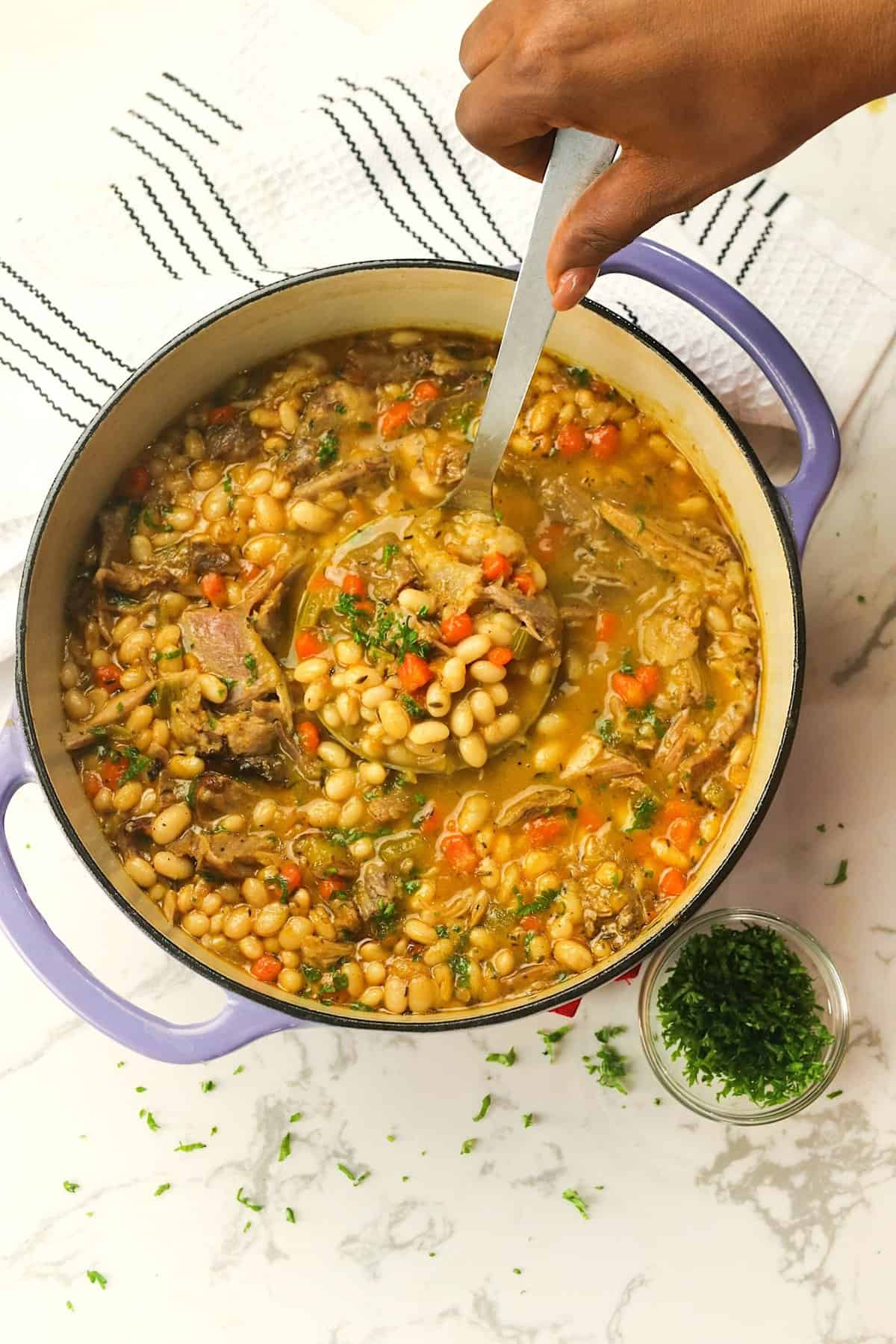 Serving up a delicious bowl of soul food navy bean soup with ham