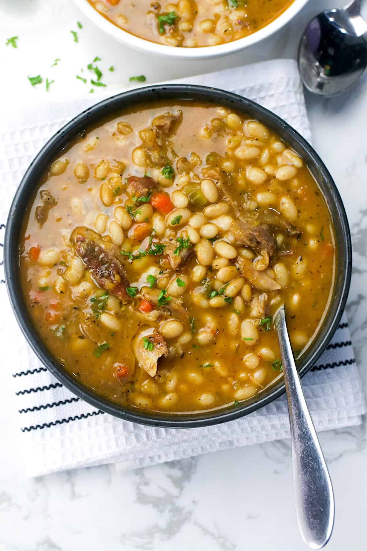 Diving into soul food perfection with a bowl of navy bean soup with ham